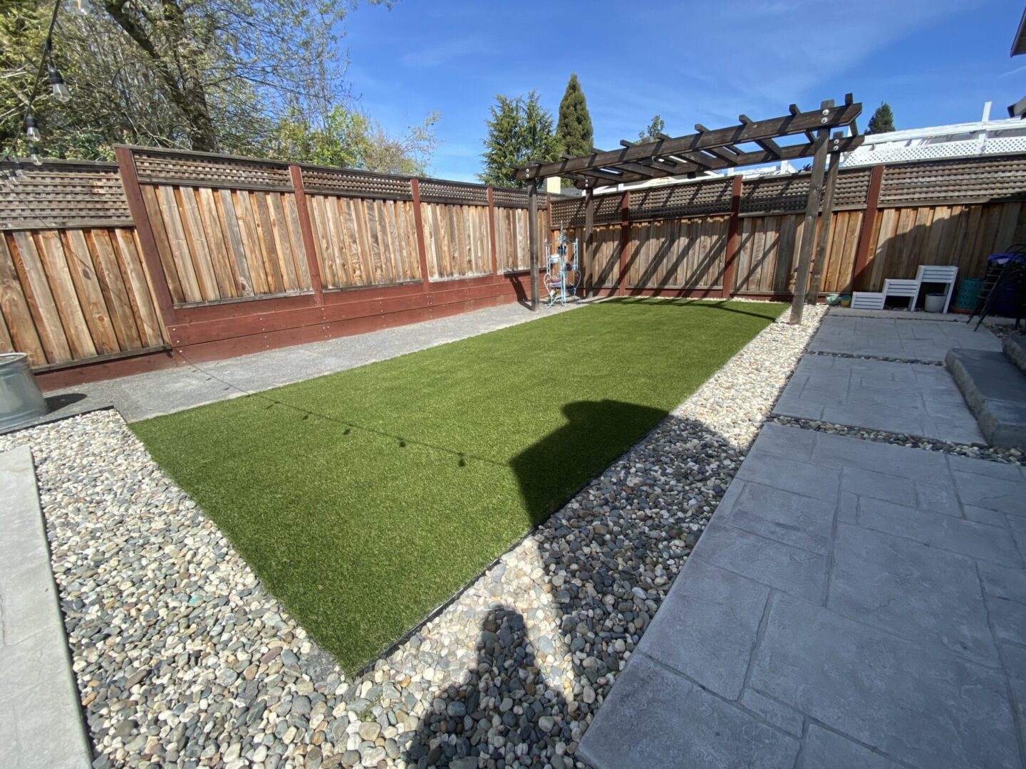 Artificial grass, pebbles, gazebo, landscaping by Guys Yard Design in Sonoma, CA