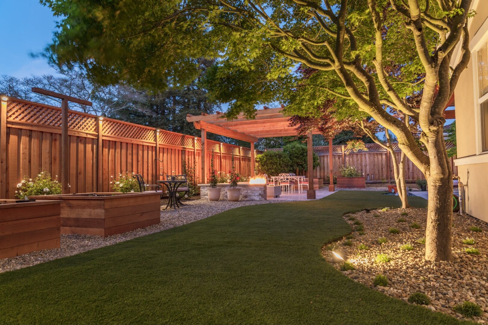 Artificial grass, pebbles, trees, gazebo, landscaping by Guys Yard Design in Sonoma, CA